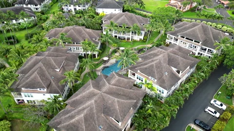 Aerial Circle of Luxury Condo Complex Pool on Kauai, Hawaii with Palm Trees Stock Footage 276738328