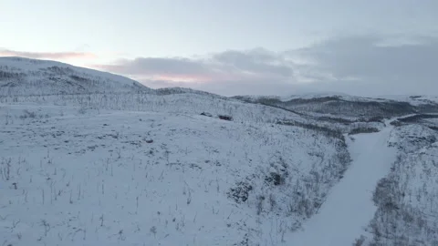 Aerial Circle Shot Of Small Cabins In Winter Landscape During Sunrise Stock Footage 222294130
