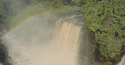 Aerial circle view big waterfall with humidity rainbow in Africa Gabon 2015 Stock Footage 82354978