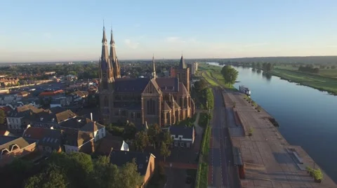 Aerial circling beautiful big church,Cuijk,Netherlands Stock Footage