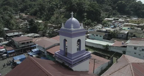 Aerial circling pull back reveal of the main church in Portobelo, Panama Stock-Footage 99847272