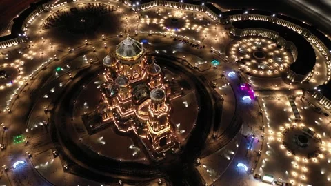Aerial circular drone view around lit cathedral Stock Footage 323256911