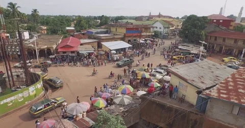 Aerial circular intersection downtown peoples and electrics cables in Guinea  Stock Footage 82398982