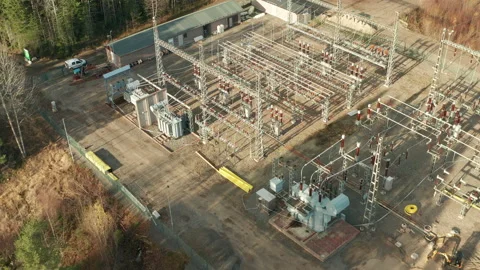 An aerial circular orbit view, high voltage electric power substation Stock Footage 195351068