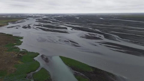 Aerial circular shot of river branches in South Iceland on a cloudy day 4K Video stock 279666756