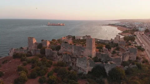 Aerial circular side view Antik kiz kalesi fortification walls close-up in Ki Stock Footage 167287509
