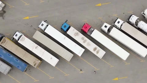Aerial circular top down view lines of lorry trucks stand symmetrical in pa.. Stock Footage 278978847