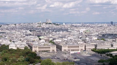 Aerial circular view of Concorde Place and Madeleine Chirch and Montmartre h Video stock 252097293