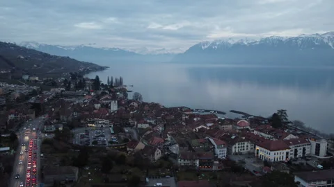 Aerial Circular View of Lutry Old Town, Lake Geneva and Swiss Alps at Blue Hour Stock Footage 328537043