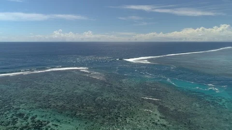 Aerial circular view of sea current on a entrance of atoll in polynesia witho Stock Footage 92077151