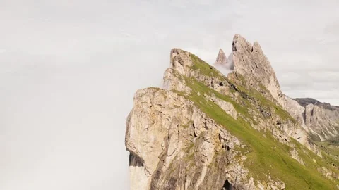 Aerial circular view Seceda ridge Odle peaks rise above clouds after rain w.. Stock-Footage 332212776