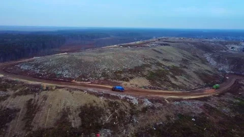 Aerial City Trash Garbage Dump. Following the Truck. Video stock 143356024