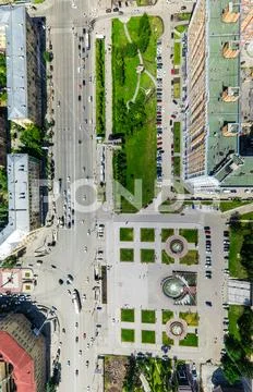 Aerial city view with crossroads and roads, houses buildings. Copter shot Stock Photos