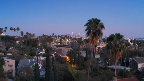 Aerial city view of Hollywood at dusk. Zooming in downtown Los Angeles skyline Stock Footage