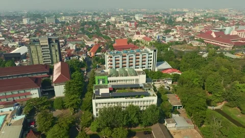 Aerial cityscape featuring solar panels on large urban building Stock Footage 342581019