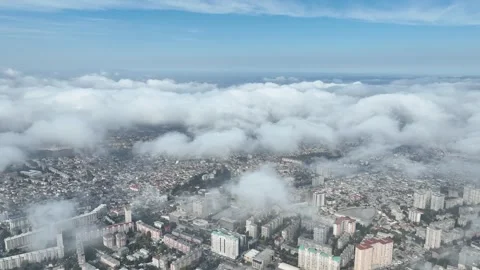 Aerial Cityscape View with Clouds Above Urban Buildings and Blue Sky Stock Footage 341892708