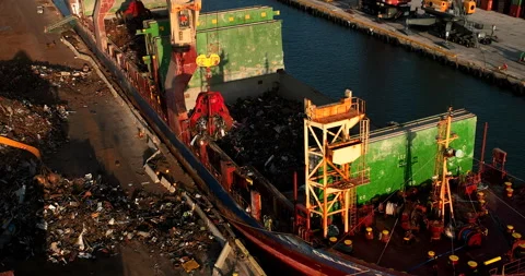 Aerial Claw Loading Trash onboard Cargo Ship Stock Footage 242114793