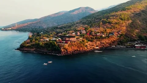 Aerial Cliffside Sunset Point and Jemeluk Bay in Amed Bali Stockbeeldmateriaal 348567232