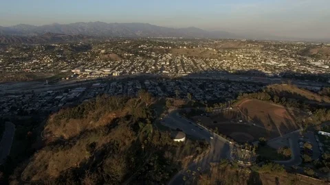 Aerial clip above baseball fields and Cypress Park neighborhood of Los Angeles Stock Footage 86387226