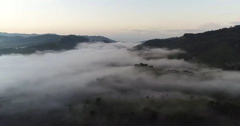 Aerial clip above clouds in a rural valley of Costa Rica Stock Footage 86537009