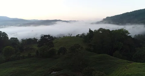 Aerial clip at dawn above clouds in a rural valley of Costa Rica Stock Footage 86535203