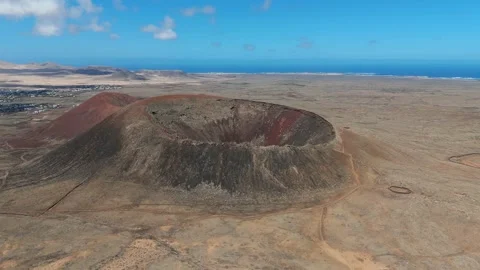 Aerial clip of the dramatic Volcan Calderon Hondo volcano Fuerteventura Stock Footage 277117993