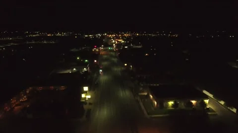 Aerial clip of a rural towns lights late at night Stock Footage