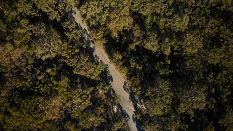 Aerial clockwise spinning shot over australian dirt road Video stock 112635284