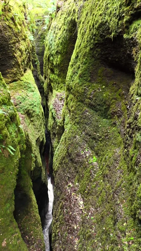Aerial Close-up of Ancient Rock Formations and River - Evanton Stock Footage 330660361