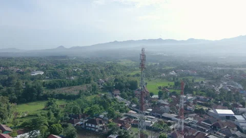 Aerial Close Up of Communication Tower in Hillside Village Video stock 309431206