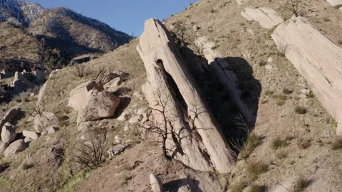 Aerial close-up of dramatic rock formations at Devil's Punchbowl, a sharp Stock Footage 284197018