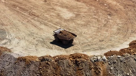 Aerial close up of dump truck in mining pit Utah high desert 動画素材 335832521