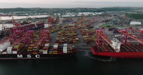 Aerial close-up fly over view of shipping containers on docks at Durban harbour Stock Footage 175333701