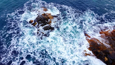 Aerial close up of foamy wave breaking near rock, Bulgaria Stock Footage 340410855
