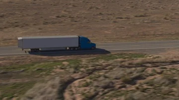 AERIAL CLOSE UP Freight container semi truck logistics transportation on highway Stock Footage 85758167