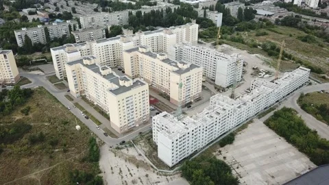 Aerial close in front of windows modern dormitory area houses buildings Stock Footage 136962369