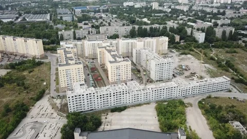Aerial close in front of windows modern dormitory area houses buildings Stock Footage 136962496