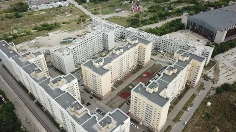 Aerial close in front of windows modern dormitory area houses buildings Stock Footage 136962531