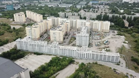 Aerial close in front of windows modern dormitory area houses buildings Stock Footage 136962579