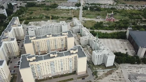 Aerial close in front of windows modern dormitory area houses buildings Stock Footage 136962730