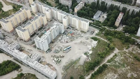 Aerial close in front of windows modern dormitory area houses buildings Stock Footage 136962809