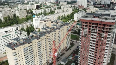 Aerial close in front of windows modern dormitory area houses buildings Stock Footage 136965599