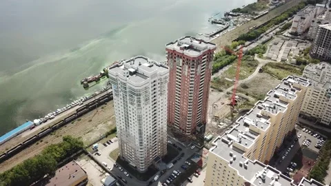 Aerial close in front of windows modern dormitory area houses buildings Stock Footage 136965723