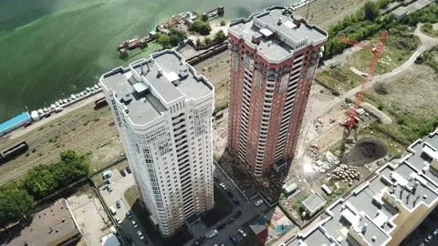 Aerial close in front of windows modern dormitory area houses buildings Stock Footage 136966124