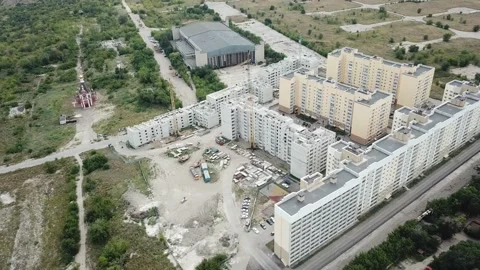 Aerial close in front of windows modern dormitory area houses buildings Stock Footage 136966851