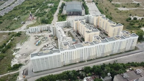 Aerial close in front of windows modern dormitory area houses buildings Stock Footage 136966915