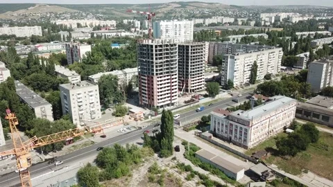 Aerial close in front of windows modern dormitory area houses buildings Stock Footage 136995105