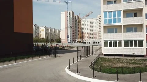 Aerial close in front of windows modern dormitory area houses buildings Stock Footage 137145066