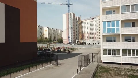 Aerial close in front of windows modern dormitory area houses buildings Stock Footage 137145153