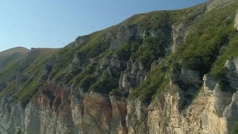 Aerial close up golden eagle flight over epic mountains Flock carnivore Caucasus Stock Footage 150991943